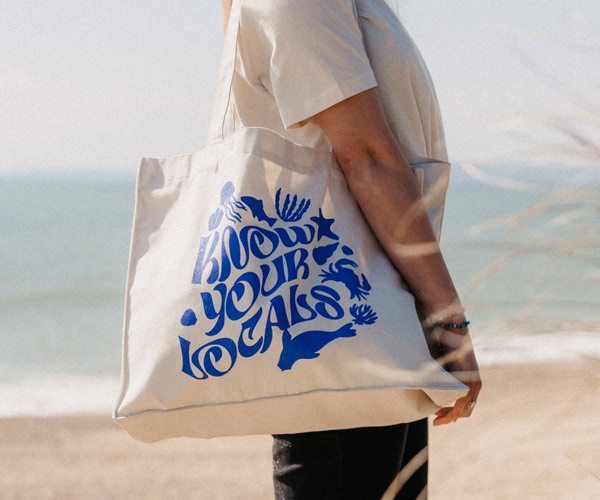 Custom Tote Bags Melbourne with the text design "Know Your Locals" Screen Printed with Blue Plastisol Ink