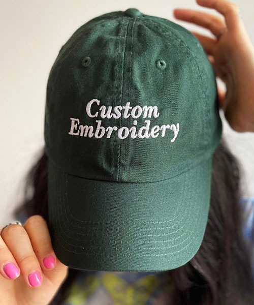 custom embroidery cap with white thread stitching on the front