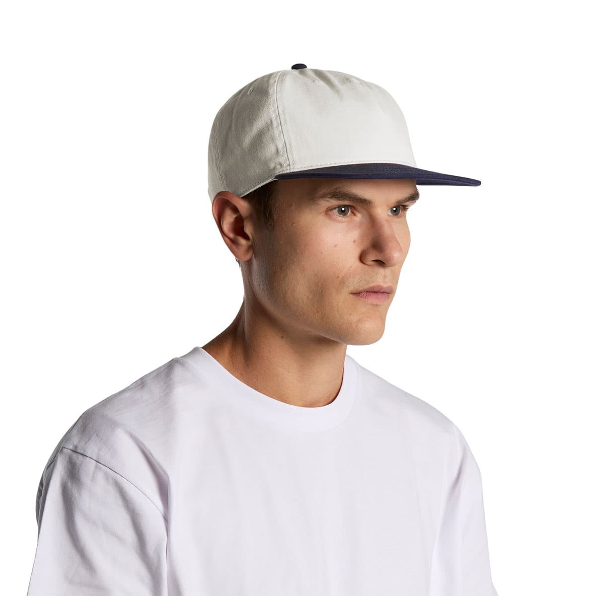 A stylish natural and midnight AS Colour Two Tone Cap, showcasing a flat peak and a sleek two-tone design, perfect for custom printing or embroidery.