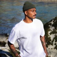 Fisherman Beanie model view in a fishing scene promoting style, comfort and seasonality