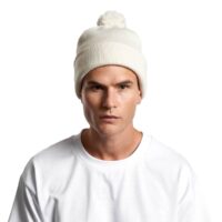 A cozy AS Colour Pom Pom Beanie in Ecru worn by a male featuring a cuffed hem and a tonal pom pom.
