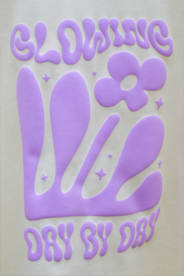 Puff Print in Lilac colour on the AS Colour Heavy Tee in Butter